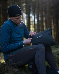 *MALE*  in woods unpacking Tech-Lite Dryrobe®