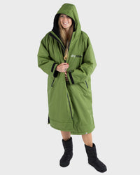 Woman wearing Forest Green dryrobe® Advance Long Sleeve and dryrobe® Thermal Boots
