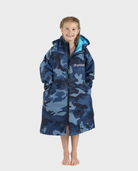 Girl wearing dryrobe Advance Long Sleeve Changing poncho in Blue Camo Blue with zip up