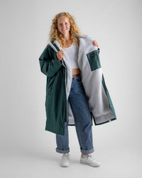 Female in studio wearing AW25 Green Dryrobe® advance long sleeve 