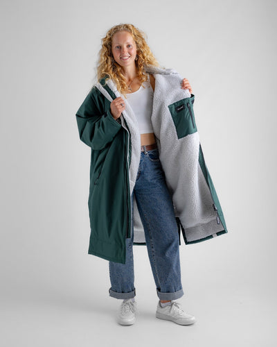 Female in studio wearing AW25 Green Dryrobe® advance long sleeve 
