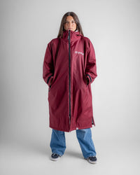 Female in studio wearing AW25 Burgundy Dryrobe® advance long sleeve 