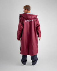 *MALE* in studio wearing AW25 Burgundy Dryrobe® advance long sleeve 