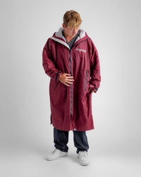 *MALE* in studio wearing AW25 Burgundy Dryrobe® advance long sleeve 