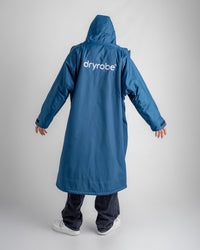 *MALE* in studio wearing AW25 Blue Dryrobe® advance long sleeve 