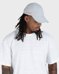 male in studio wearing grey Dryrobe® water resistant cap 