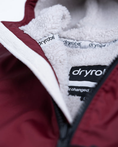 Detail studio shot of AW25 Burgundy Dryrobe® advance long sleeve 
