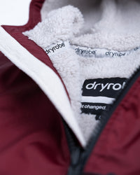 *MALE* Detail studio shot of AW25 Burgundy Dryrobe® advance long sleeve 