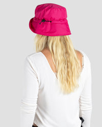 Woman with back to the camera, wearing dryrobe Fleece Lined Bucket Hat in Pink