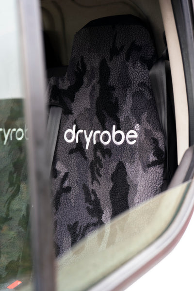 Dryrobe towel inside a car door with visible branding