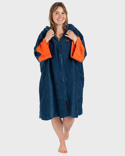 Female in studio wearing Dryrobe® Zip towel (blue orange)