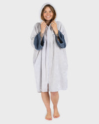 Adult female in studio wearing Dryrobe® Zip towel (nimbus cloud)