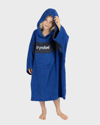 Child wearing Kids Organic Towel dryrobe - Remix in Royal Blue Navy with hood up 