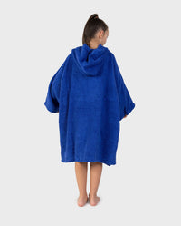 Child with back to the camera wearing Kids Organic Towel dryrobe - Remix in Royal Blue Navy