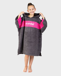 Girl wearing Kids Organic Towel dryrobe - Remix in Slate Grey Pink