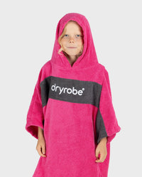 Child wearing Kids Organic Towel dryrobe - Remix in Pink Slate Grey with hood up 