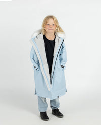 Child wearing dryrobe Advance Long Sleeve Alpine Range changing robe in Alpine Ice Blue 