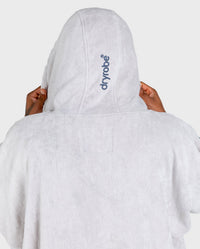 *MALE* in studio wearing Dryrobe® Zip towel (nimbus cloud)