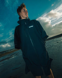 *MALE*  standing by lake wearing Tech-Lite Dryrobe®