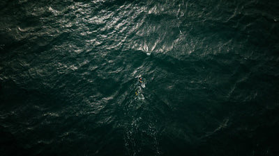 Ross Edgley swimming in the middle of a dark ocean