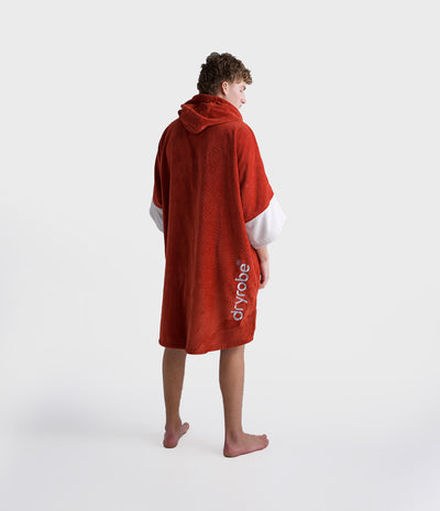 *MALE* Person wearing a red dryrobe on a white background