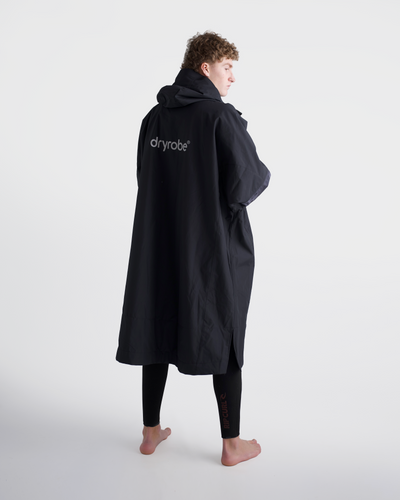 *MALE*Person wearing a black dryrobe on a white background