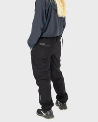 Woman stood facing away from camera, wearing dryrobe® Thermal Trousers