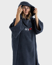 Woman wearing Navy dryrobe® Organic Cotton lightweight, super-soft-to-touch towel poncho