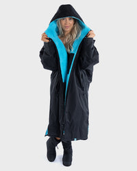 Woman wearing Stay Wild dryrobe® Advance with hood up