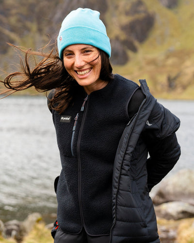 Female wearing Dryrobe® fleece gilet underneath Dryrobe® mid-layer jacket 