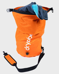 dryrobe Compression Travel Bag in Orange showing towel inside