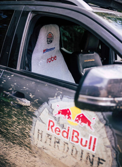 Red Bull branded car showing a customised Dryrobe® seat cover