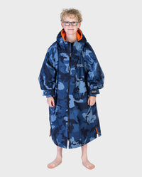 Boy wearing dryrobe Advance Long Sleeve Changing poncho in Blue Camo Orange