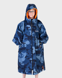 Boy wearing dryrobe Advance Long Sleeve Changing poncho in Blue Camo Orange with hood up 