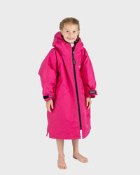 Child wearing dryrobe Advance Long Sleeve changing poncho in Pink Light Grey