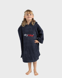 Girl looking up wearing Organic Towel dryrobe in Navy with hands on her hips