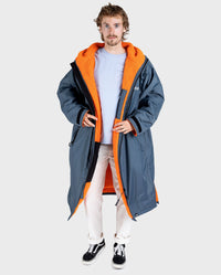 **MALE**  Man wearing dryrobe Advance Long Sleeve change poncho in Dark Grey Orange 