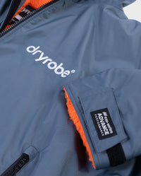 **MALE** Close up of end of sleeve on dryrobe Advance Long Sleeve change poncho in Dark Grey Orange