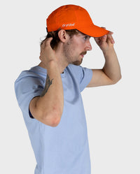 *MALE* Man stood facing the right, wearing Orange dryrobe Quick Dry Cap