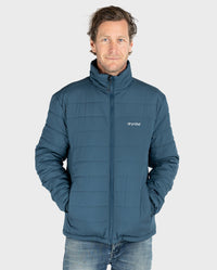 Man wearing dryrobe Mid-layer Jacket in Deep Sea Blue 