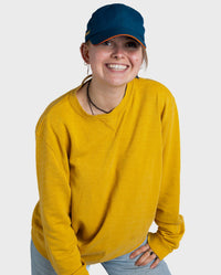 Woman smiling wearing Deep Sea Blue dryrobe Quick Dry Cap