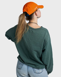 Woman with back to the camera wearing Orange dryrobe Quick Dry Cap