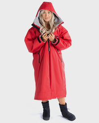 1|Woman wearing Red Grey dryrobe® Advance Long Sleeve with the hood up