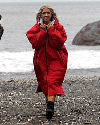 1|Woman walking away from the sea, wearing Red Grey dryrobe® Advance Long Sleeve 