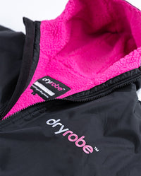 1|Close up of hood and logo on Black Pink dryrobe® Advance Short Sleeve unzipped