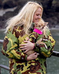 1|Woman holding small dog, wearing matching Camo Pink dryrobes