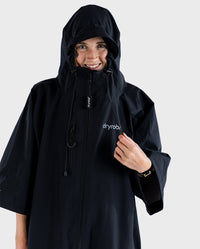 Woman smiling wearing dryrobe® Lite with hood and zip up