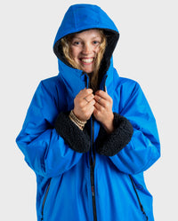 Close up of woman wearing Cobalt Blue Black dryrobe® Advance Long Sleeve with hood up