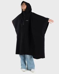 Woman wearing Black dryrobe® Waterproof Poncho with arms out to the side