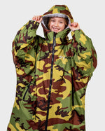 Girl wearing dryrobe Advance Long Sleeve changing poncho in Camo Grey holding hood up